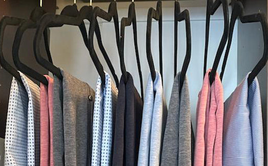 folded shirts on hangers